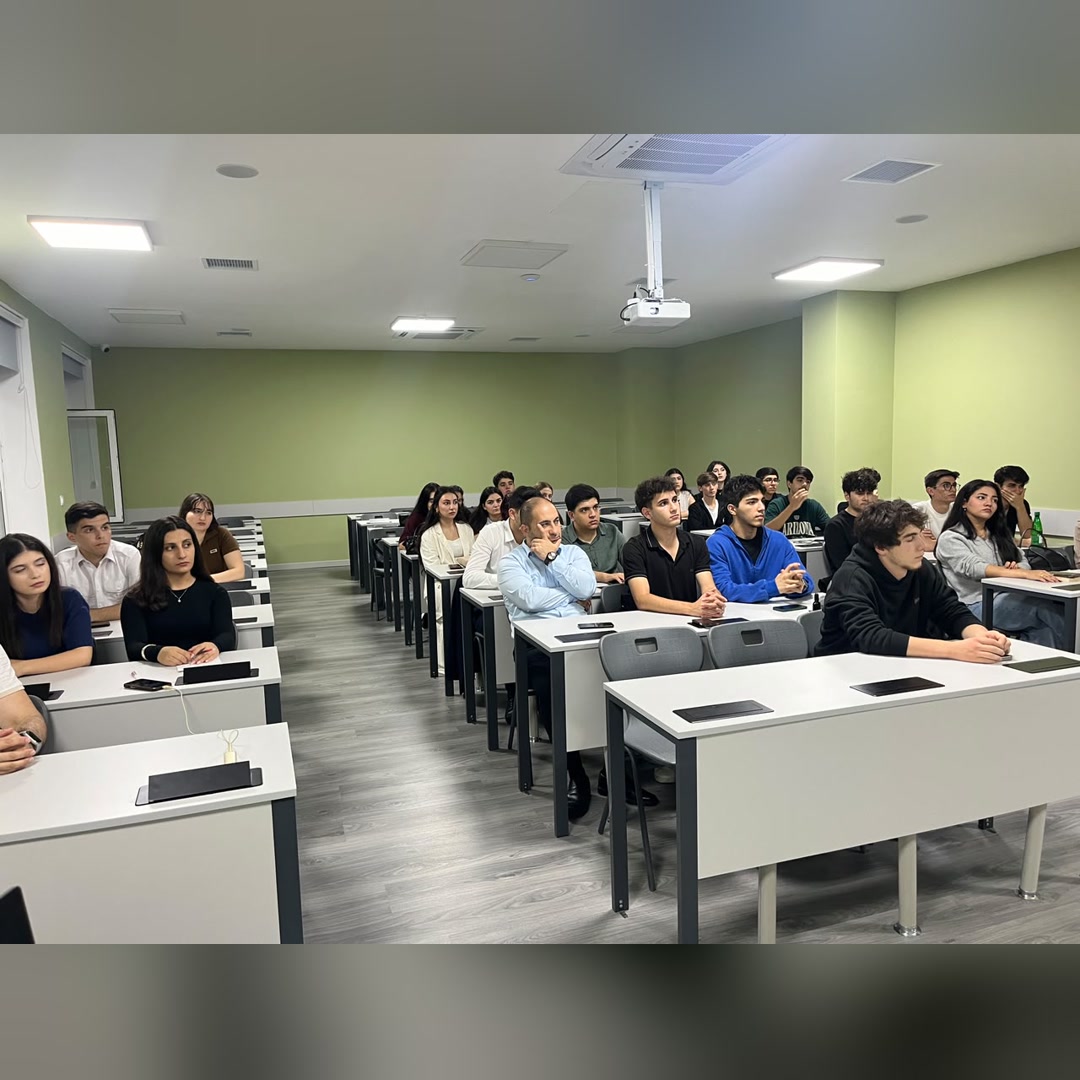 Wide view of attendees seated in the classroom during the first session.